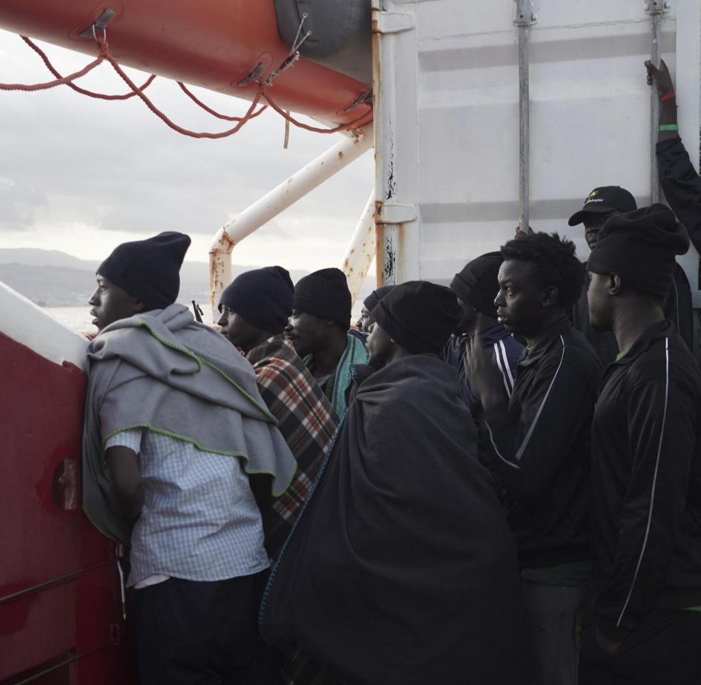 Men-wait-to-disembark-from-the-Ocea